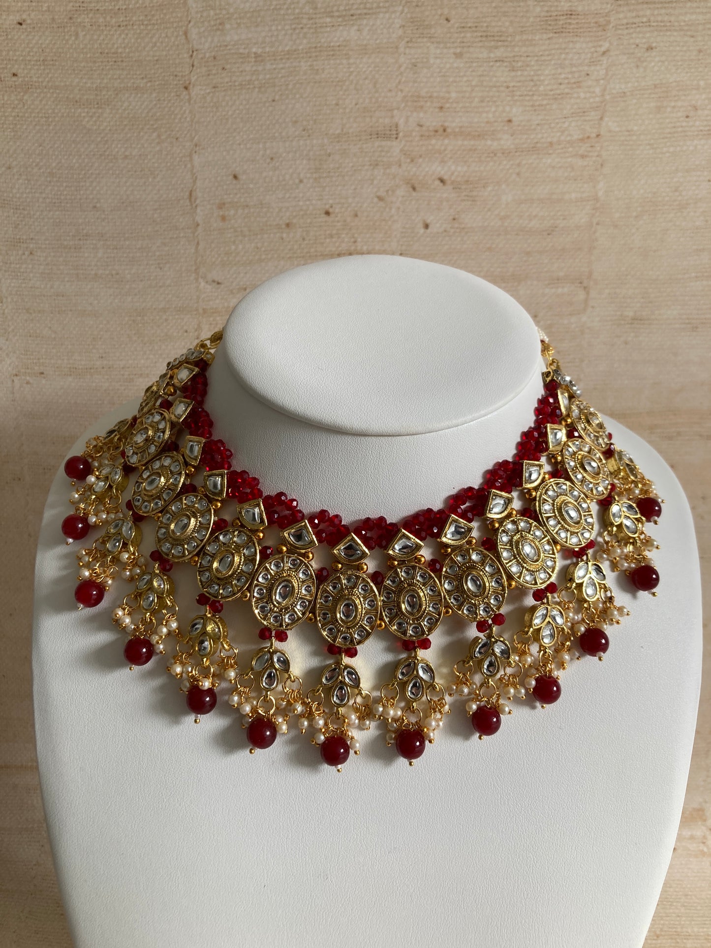 Saachi Gold Plated Kundan And Pearl Maroon Choker Set (ST184)