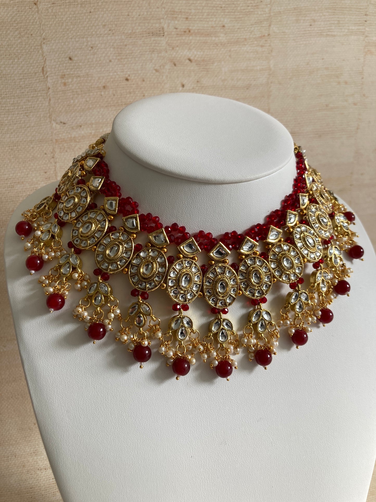 Saachi Gold Plated Kundan And Pearl Maroon Choker Set (ST184)