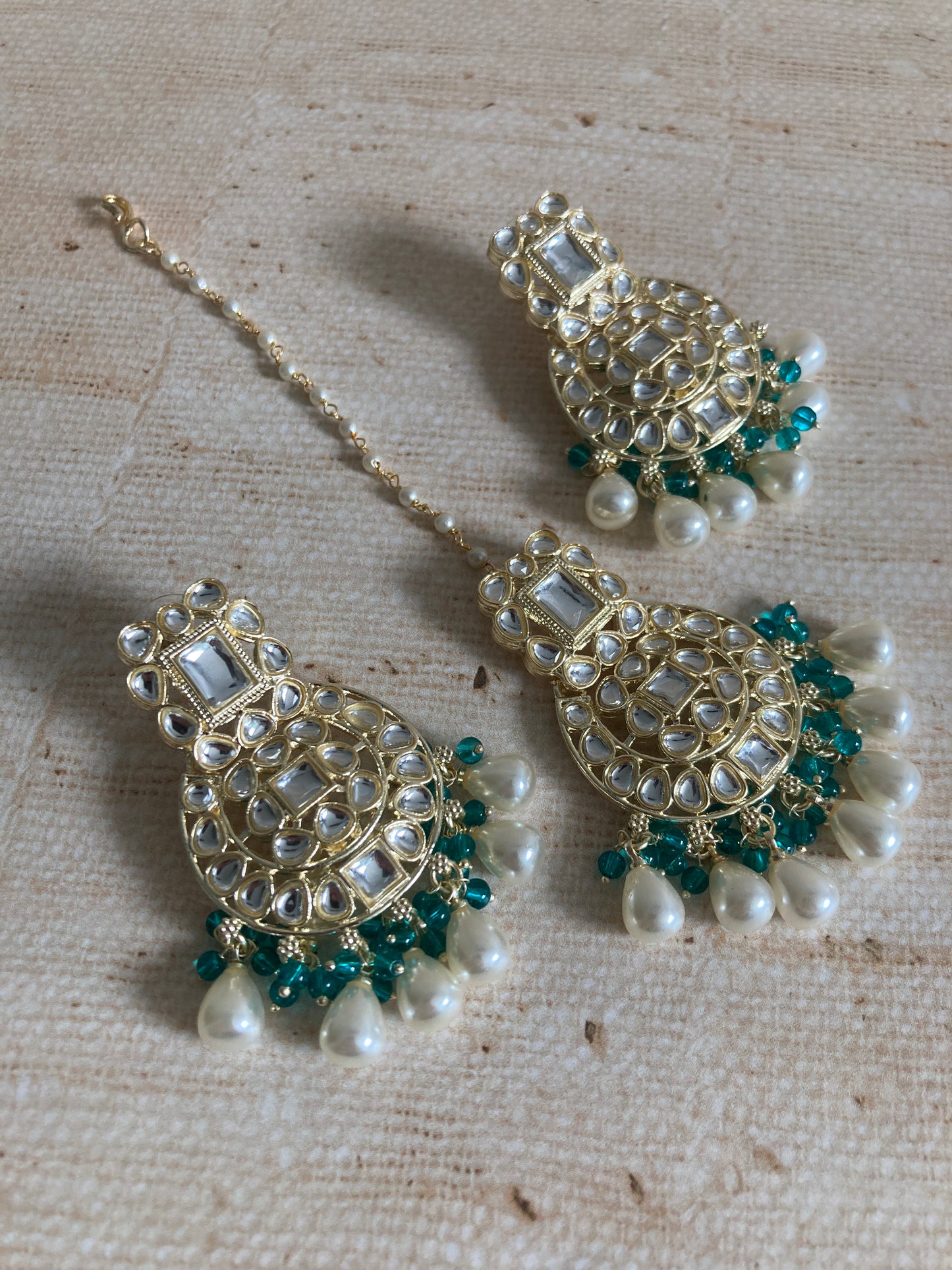 Inaya Green Gold Plated Kundan Earrings And Tikka Set (ST944)