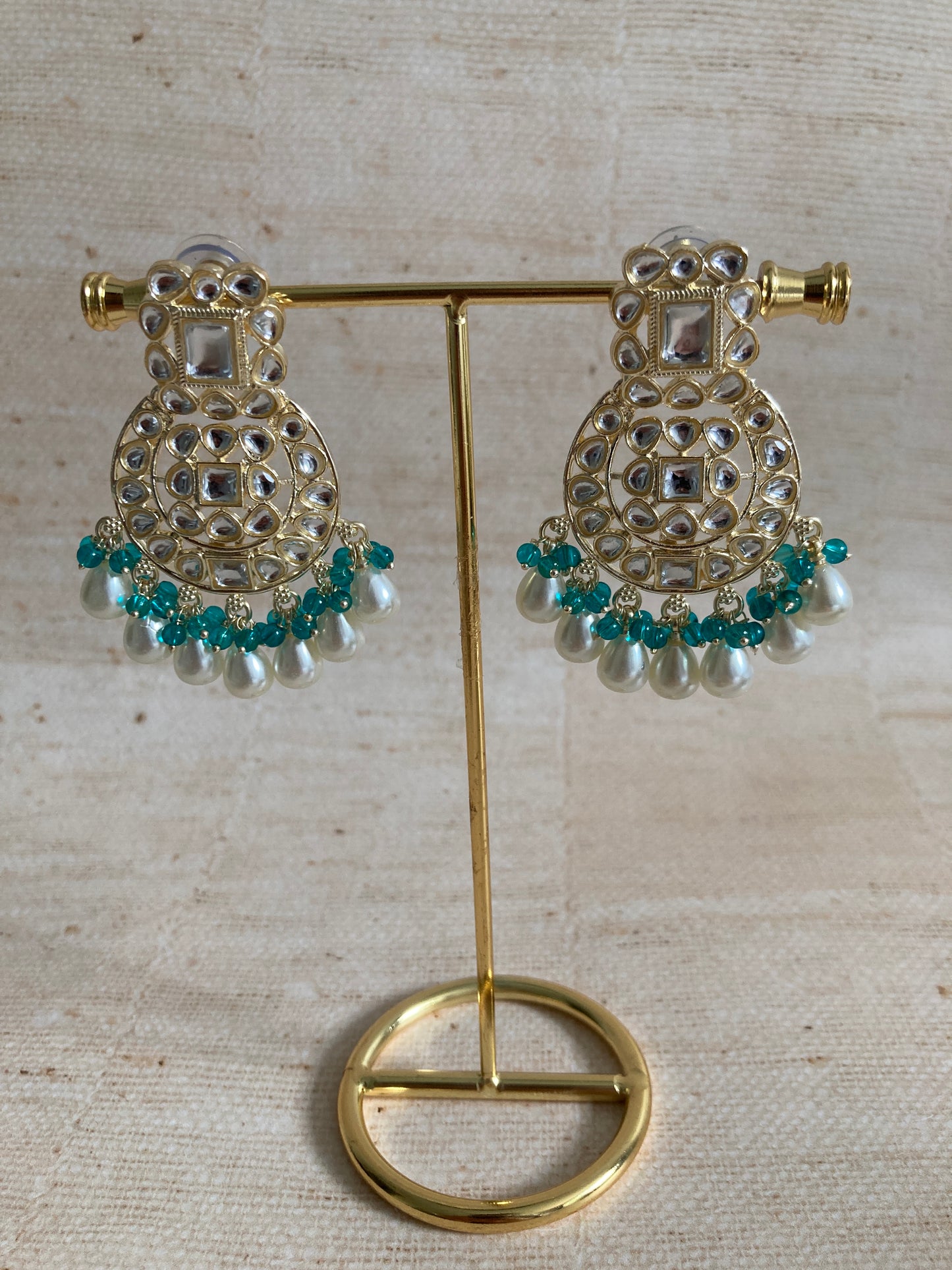 Inaya Green Gold Plated Kundan Earrings And Tikka Set (ST944)