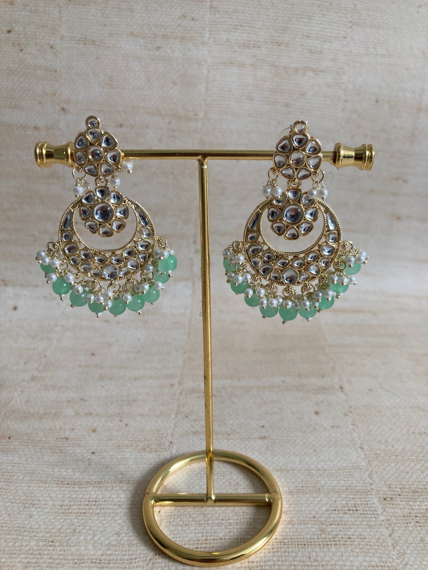 Ila Mint Green Gold Plated Kundan Earrings And Tikka Set (ST943)
