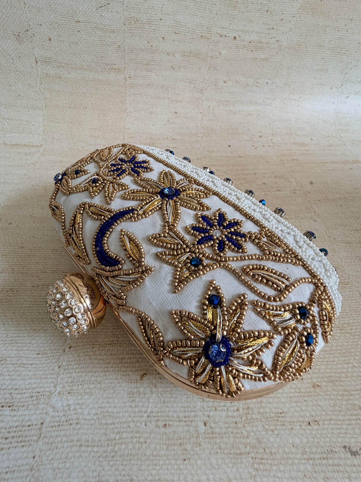 Fiorella Oval Off White Clutch (ST1168)