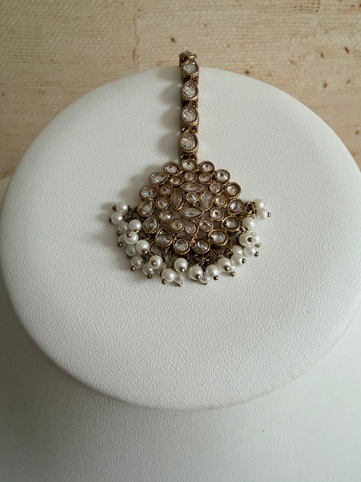 Jewelry box with a decorative brooch on a textured surface