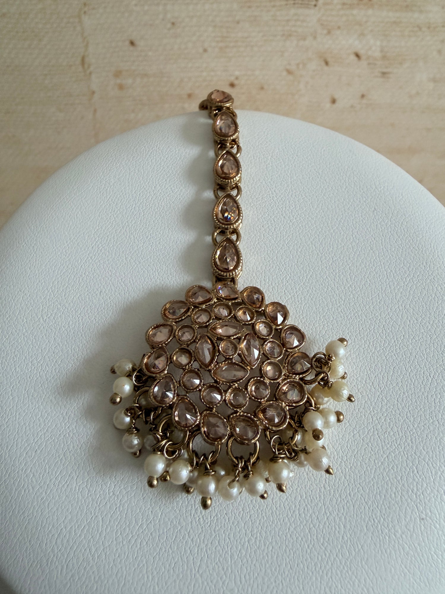 Jewelry bracelet with pearls and crystals on a light background