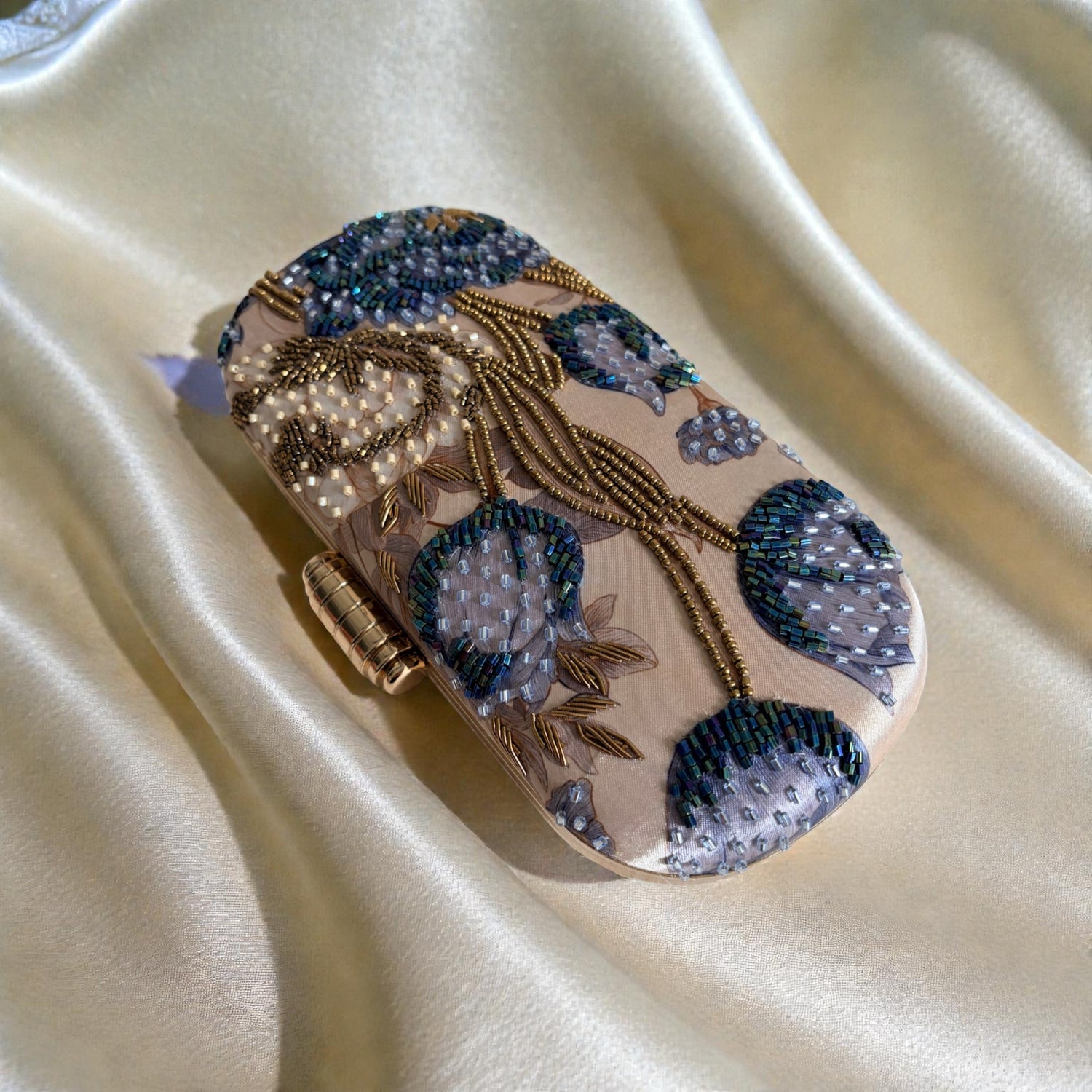 Decorative phone case with floral patterns on a beige fabric background
