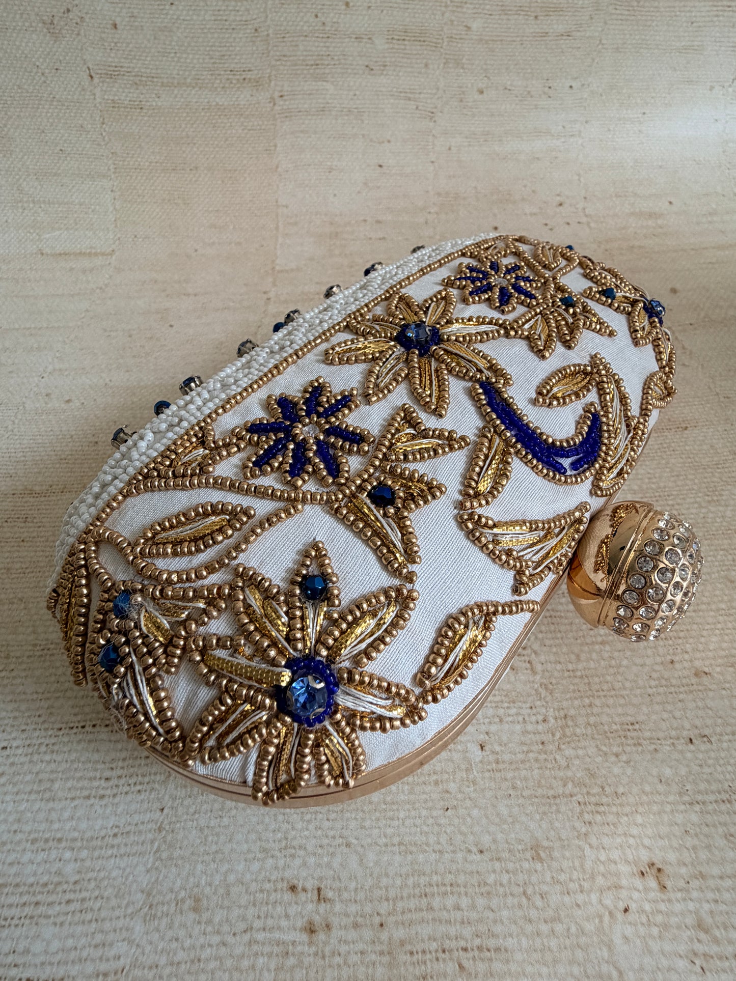 Fiorella Oval Off White Clutch (ST1168)